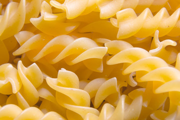 Dried fusilli Italian pasta, ready to be cooked. Fusilli background.
