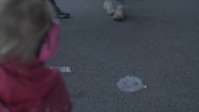 Bubble exploding with smoke inside at a summer festival