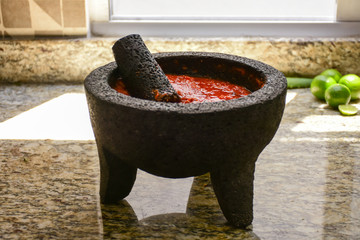 Spicy Mexican sauce in a Traditional Mexican molcajete container
