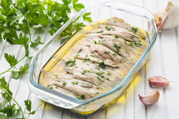 Marinated anchovies with olive oil and parsley