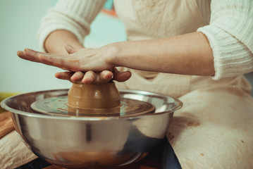 man working on a potter's wheel