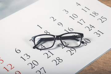 Eye Glasses on Calendar in white Tone