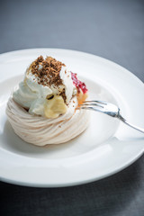 Pavlova cake with berries, vanilla, chocolate