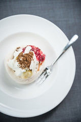 Pavlova cake with berries, vanilla, chocolate
