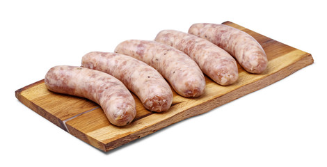 Raw homemade sausages on wooden board, isolated on white background.