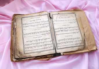 Naklejka premium The Quran is an ancient or Islamic book