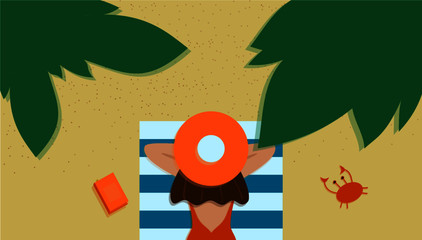 girl with a hat on a beach towel with green leaves next to a book and a crab 
