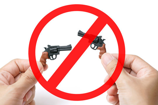  Red Sigh Forbidden on Couple Tiny Model Pistol Gun Hold by Hand on White Background, Stop Gun Violence and Criminal, No Have Victim                                                                  