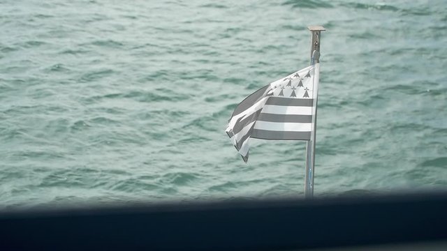 Bretagne's flag in the wind on a boat