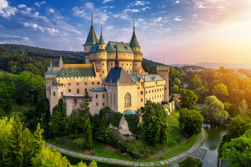 Aerial view of Bojnice medieval castle, UNESCO heritage in Slovakia. Romantic castle with gothic and Renaissance elements built in 12th century. - obrazy, fototapety, plakaty