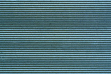 Blue background of corrugated cardboard. Horizontal stripes. Template for website, banner, poster, wallpaper.