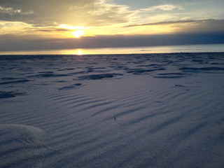 Poland Baltic Sea. View of the beach in the setting sun. Sunset.