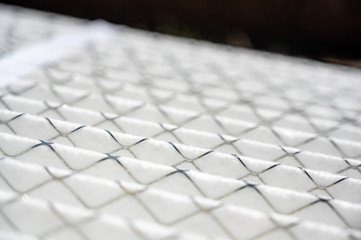Selective focus on ridged new air filter with metal wire supports