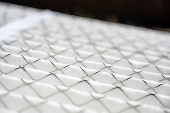 Selective focus on ridged new air filter with metal wire supports