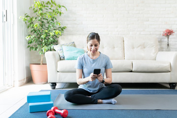 Using a smartphone and working out at home