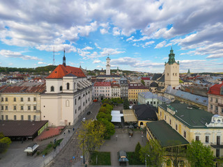 Naklejka na ściany i meble Aerial view on Jesuit Church, City Hall and Latin Cathedral in Lviv, Ukraine from drone