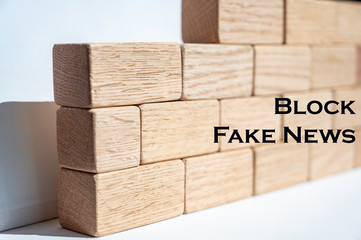 Wooden building blocks forming a wall as a concept to 