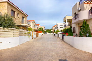 Mediterranean street with modern townhouses.