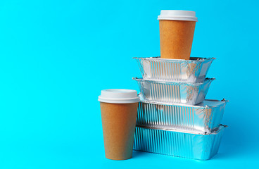 Coffee cups and takeaway food package. Takeout meal concept