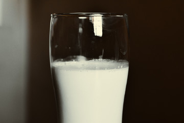 Glass of milk on table