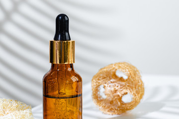 Skincare products containers on a white background with creative shadows close up