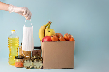 safe delivery of products from online stores takes place in a mask and gloves.Stay at home. A...