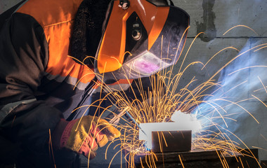 Welders working at the plant produce metal structures