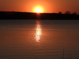 Naklejka premium sunset on the river