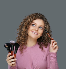 Applying Make-up. Woman with a brush for make-up	