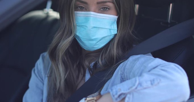 A Cleared Woman With Mask Shows ID At A Drive Through Test Clinic During The Covid-19 Coronavirus Pandemic Epidemic.