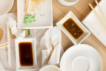 Empty dirty plate of sushi on table in cafe