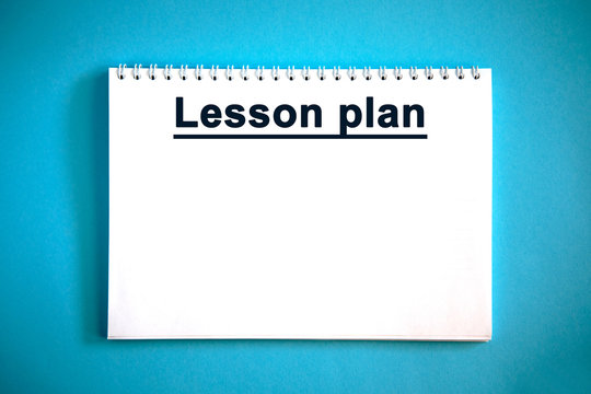 Lesson plan - text on a white notebook on a blue background