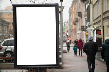 Advertising sign vertical billboard in the city on a busy street