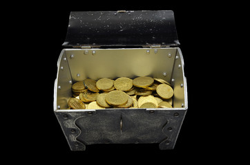 Retro Treasure chest filled with golden Coins, closeup, isloated on black Background