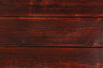 mahogany background, red parallel boards, wooden fence
