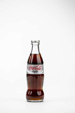 Atlanta, Georgia, USA April 1, 2020: classic contour glass bottle of Coca Cola Light from USA closeup isolated on white background