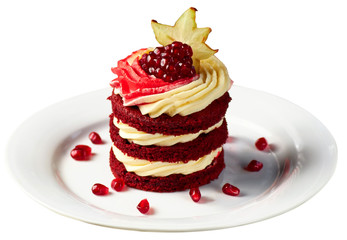 Cake Red Velvet with pomegranate and carambola, served with glass of fruit tea.