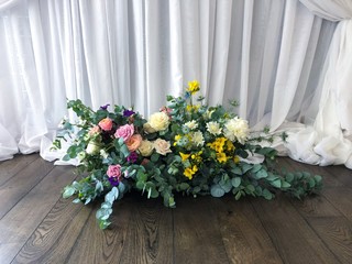 Floral wedding arrangement with eucalyptus.