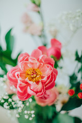 Bouquet of beautiful peonies in a vase on the table. Lovely flowers.
