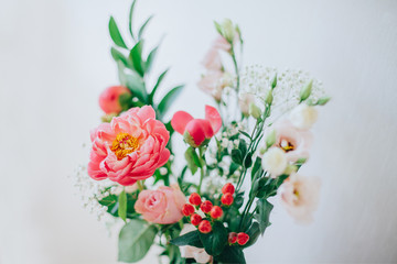 Bouquet of beautiful peonies in a vase on the table. Lovely flowers.