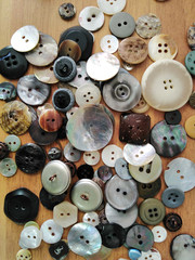 Obraz premium Variety of clothing buttons closeup on table surface