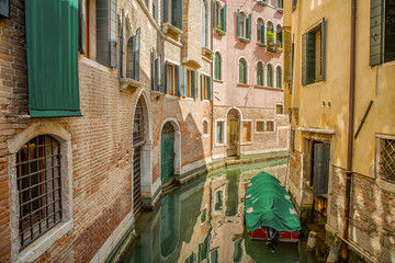 Italian waterway between the houses in Venice