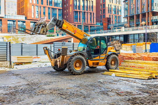 escavator on the construction site of a residential complex of houses