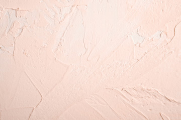Photo of creative bright textured background in cream peach and white grunge colors, backdrop