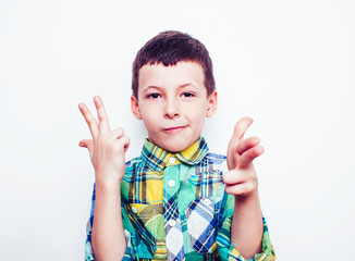 little cute real boy on white background gesture smiling close up, lifestyle people concept
