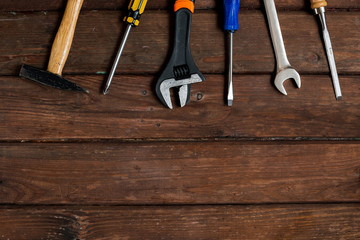 Happy Fathers Day tools, hammer on a rustic wood background. Group of repair tools on wooden background.