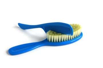  blue baby combs close-up on a white background