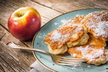 Homemade pancakes on a wooden table.