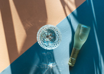 Glass of champagne isolated on coloured background with copy space