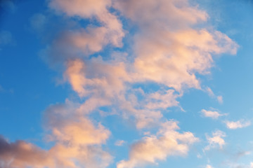 blue sky with clouds against the background of sunset